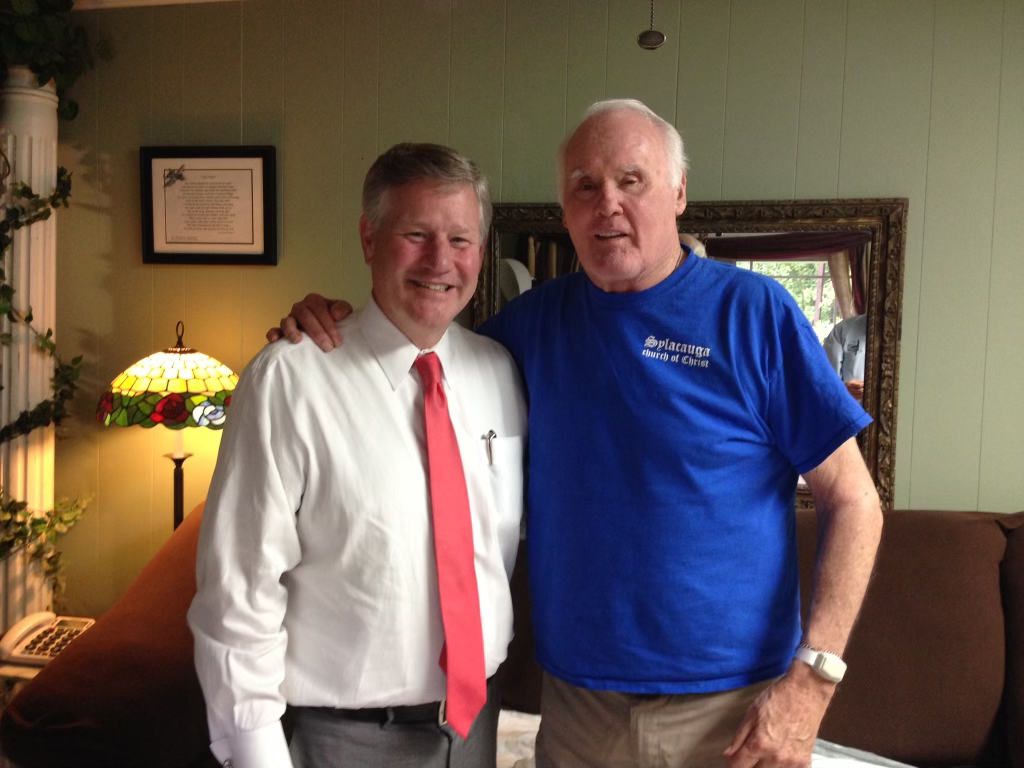 Dr. Jack Zorn, right, stands with his arm around Faulkner President Mike Williams.