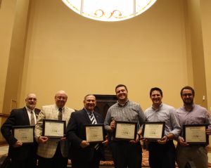 Andrew Kingsley, second from the right, spoke with several other graduates during Faulkner University's Marketplace Faith Forums. 