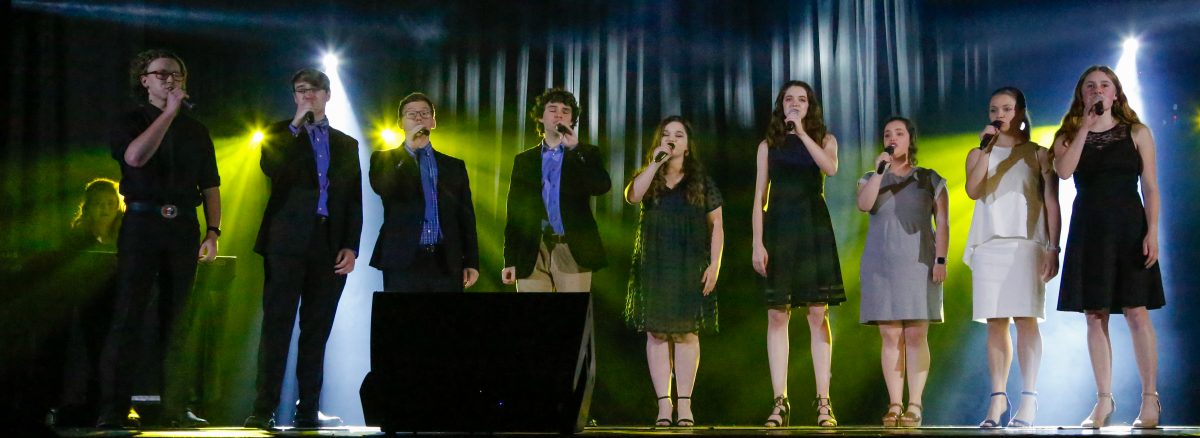 Grace Note performs at Homecoming Jam. l-r anna Wakefield, Angelina Guilbert, Scott Richardson, Caleb Harris, Ken Turrentine, Peyton Osborn, Emma Wilber, Abigail Sikes and Sarah Hardgrave.