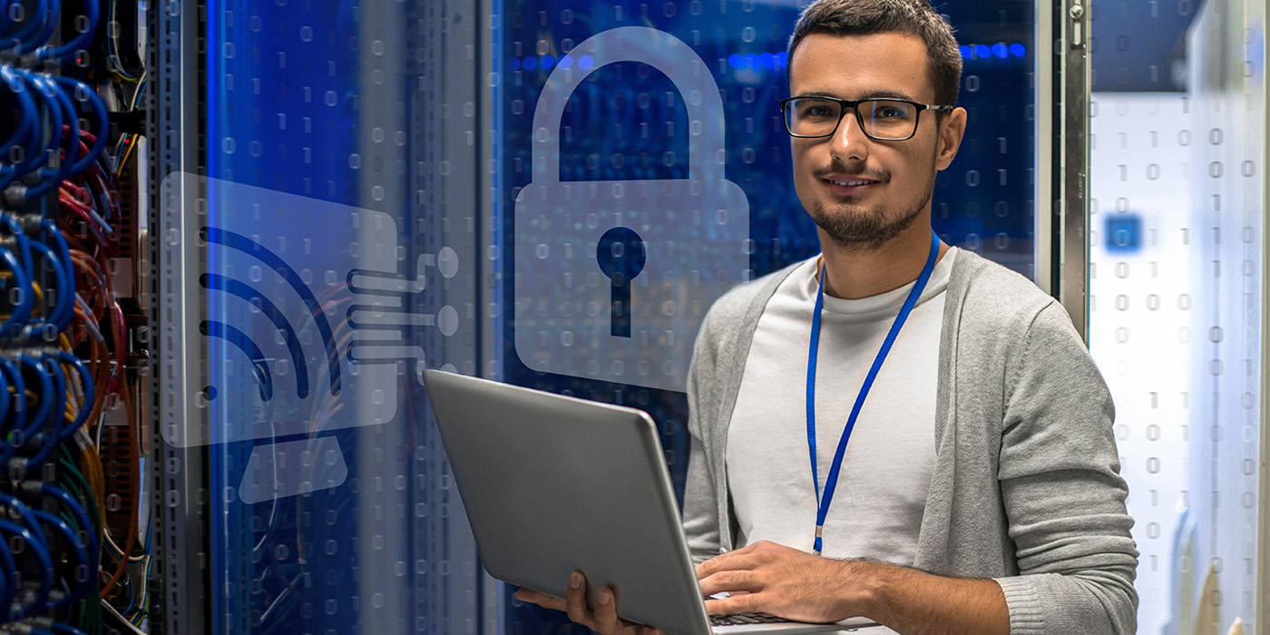 A man holding a computer