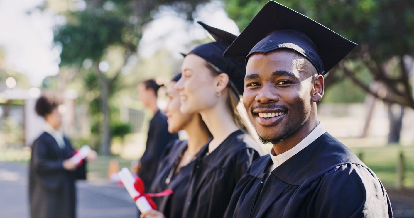 Student looking to the camera on graduation day