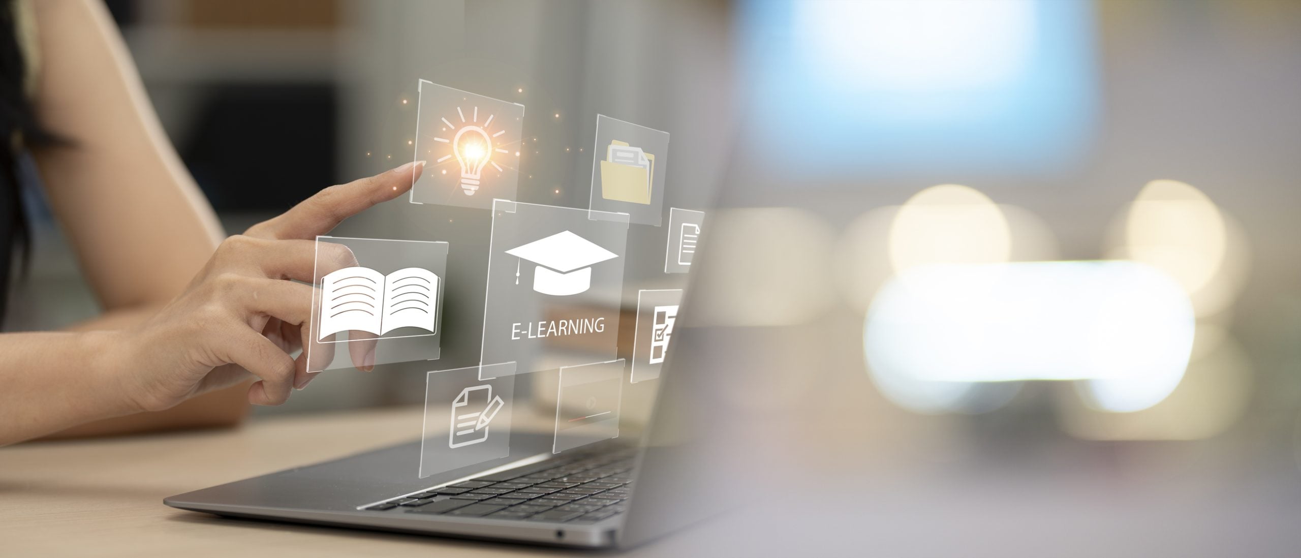 concept-illustration-of-person-using-laptop-for-online-courses-scaled-1