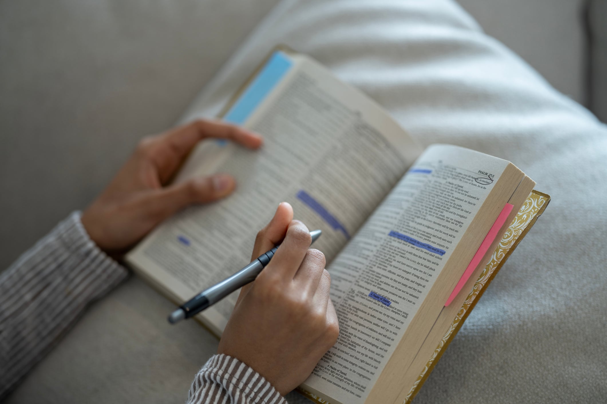 Focused Bible Study with Highlighted Texts and Notes in a Serene Setting