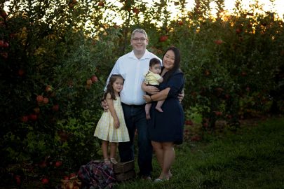 Charles Grimm poses with his wife Nancy, three-year-old daughter, Audrey and their four-month-old son.