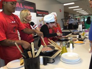 Students help cook "HEAL-icious" meals with HEAL Alabama founder, Christy Swaid and Birmingham's Kathy Mezrano with Kathy G.& Co., center, during Faulkner University's Wellness Week. 