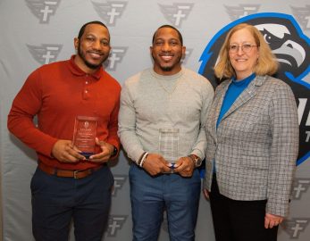 Ra'Mon and Ty'Ron West stand with Dr. Susan Hammon.