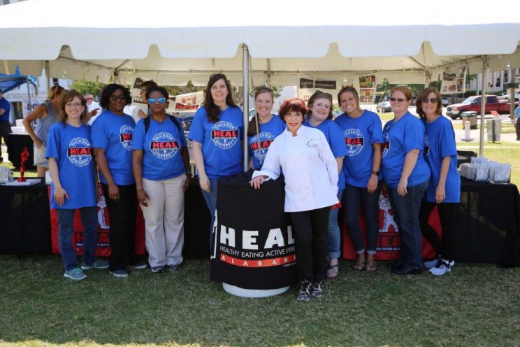 Faulkner faculty and staff joined Kathy Mezrano with Kathy G.& Co. to serve healthy treats during Alabama's HEAL Day.