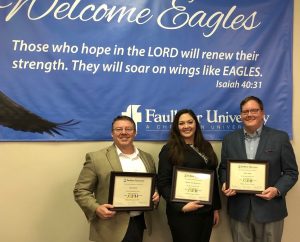 Jason Isbell, right, stands with left to right, Paul Evans and Sheena Ariel Riley Gore after presenting at the Marketplace Faith Forums on Feb. 16, 2018.