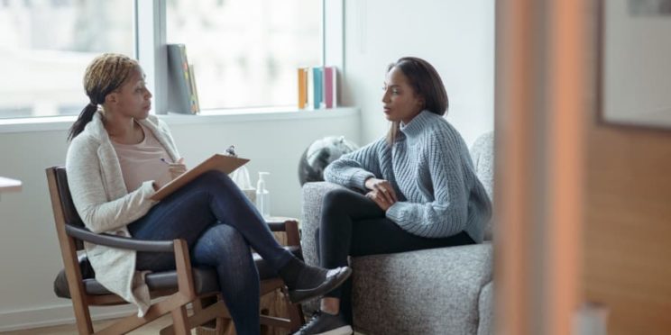 A counselor and a client talk