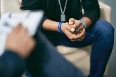 A forensic psychologist talks with a young man