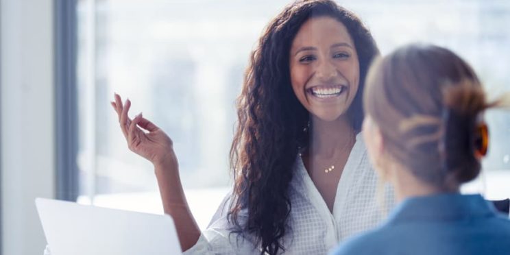 A human resource manager talks with an employee