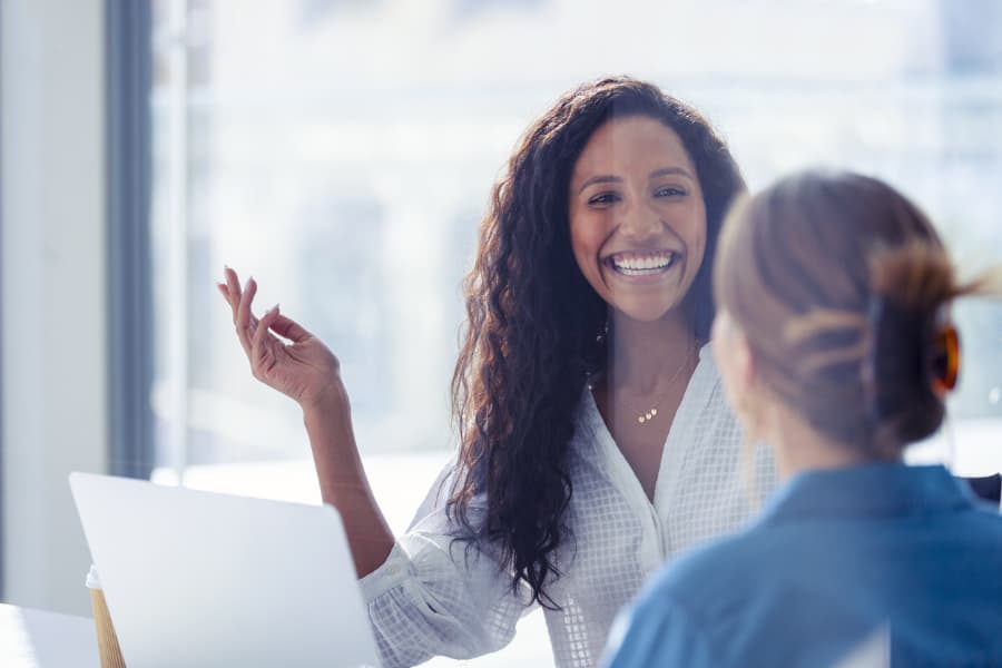 A human resource manager talks with an employee