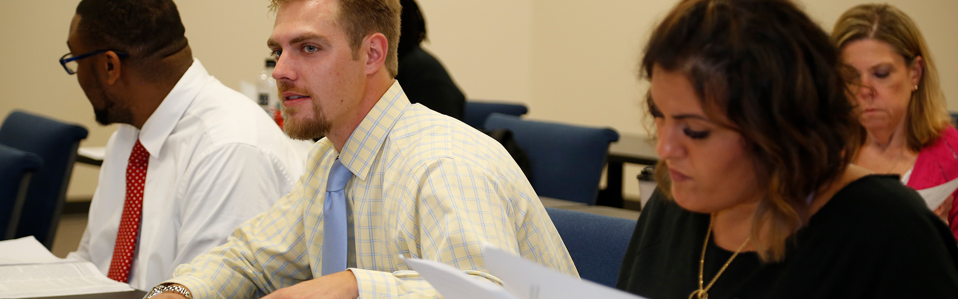 Adult Students in Business Dress in Classroom