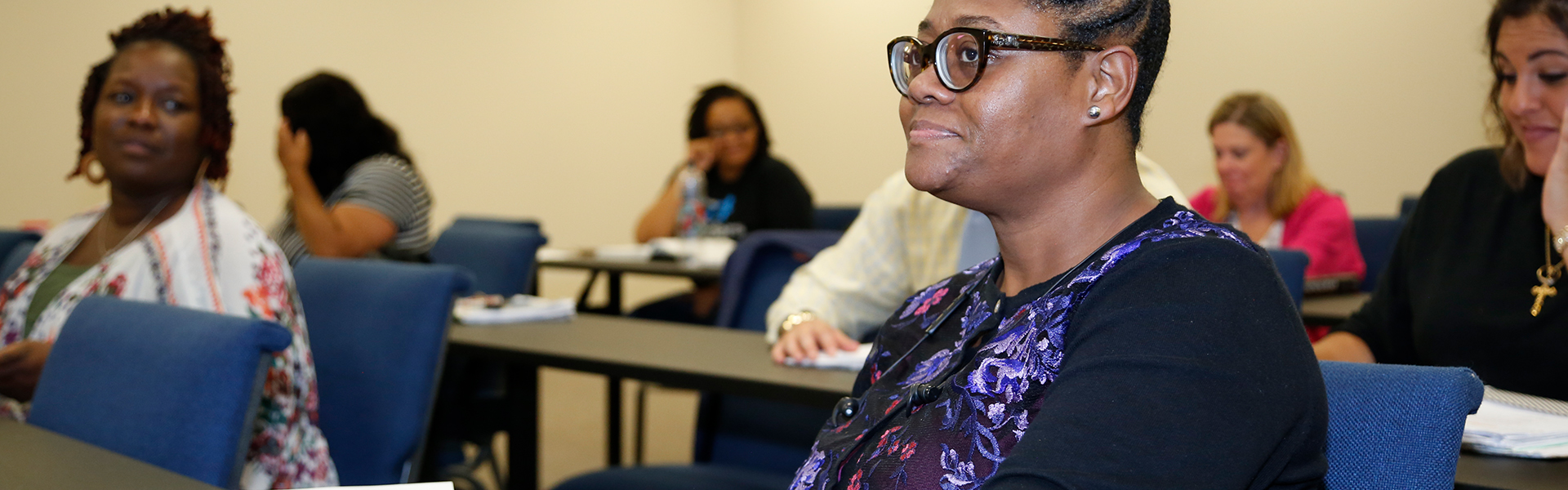 Adult student attends a seminar class within the Faulkner College of Business