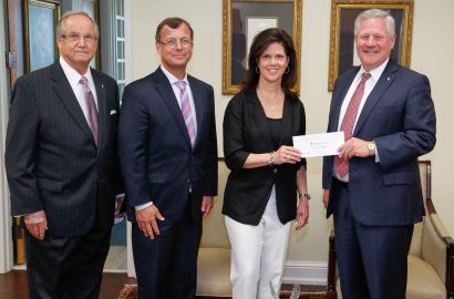 Alabama Power executives Mike Jordan and Leslie Sanders presents a grant for the College of Health Sciences to President Mike Williams and Chancellor Wayne Baker.