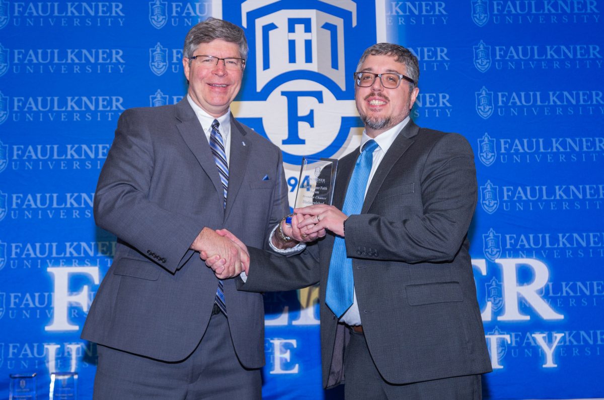 l-r President Mitch Henry presents the Distinguished Alumnus Award to Brendan Chance. 