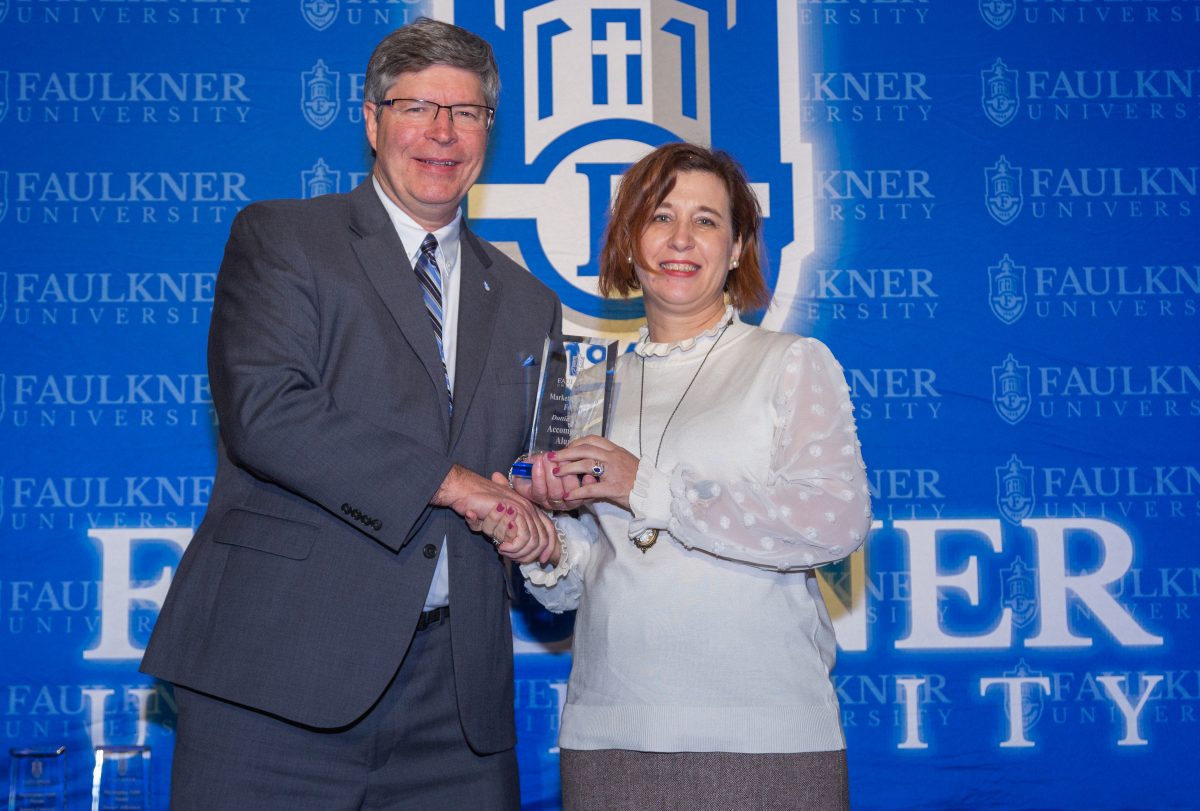 l-r President Mitch Henry presents Dottie Presley with the Accomplished Alumna Award. 