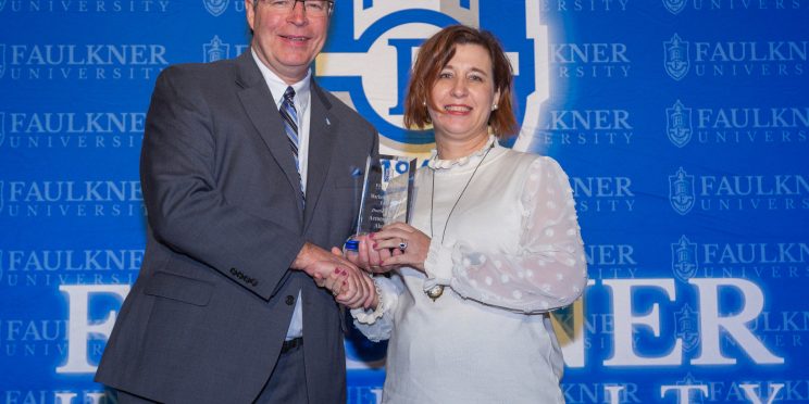 l-r President Mitch Henry presents Dottie Presley with the Accomplished Alumna Award.