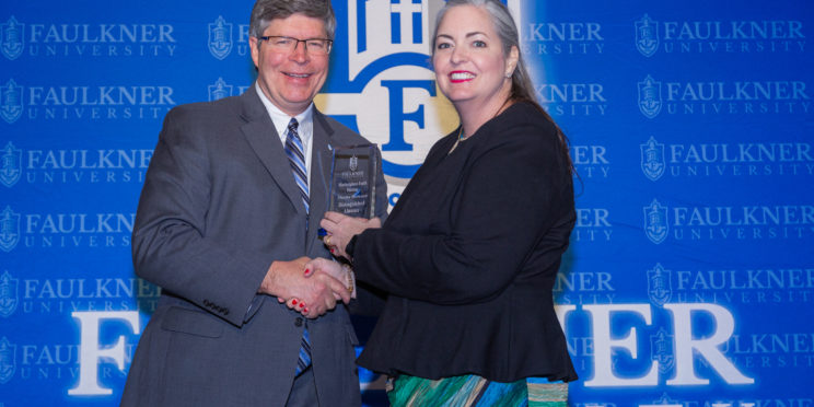 l-r President Mitch Henry presents Martha Burleson with her Distinguished Alumna Award for the 2023 Marketplace Faith Friday Forums.