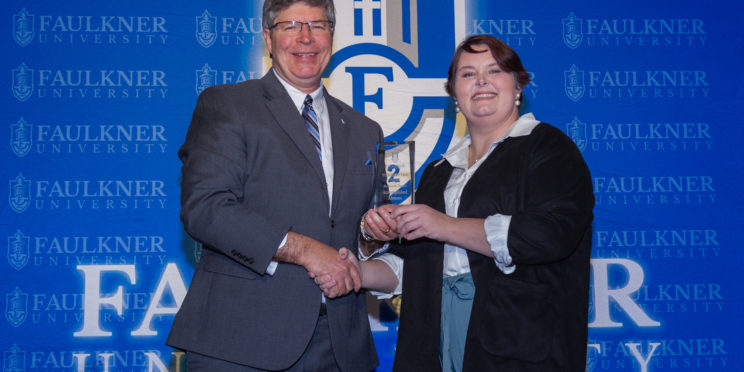 President Mitch Henry awards Rebecca Potter at this year's Faith Forums.