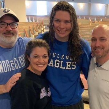 Grant made the decision to follow Christ through baptism. She poses with Coach Reed Sutton and Landmark Church's college minister Nathan Capps and his wife.