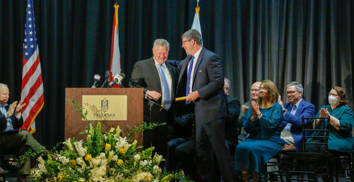 President Mike Williams hands baton to President elect Mitch Henry