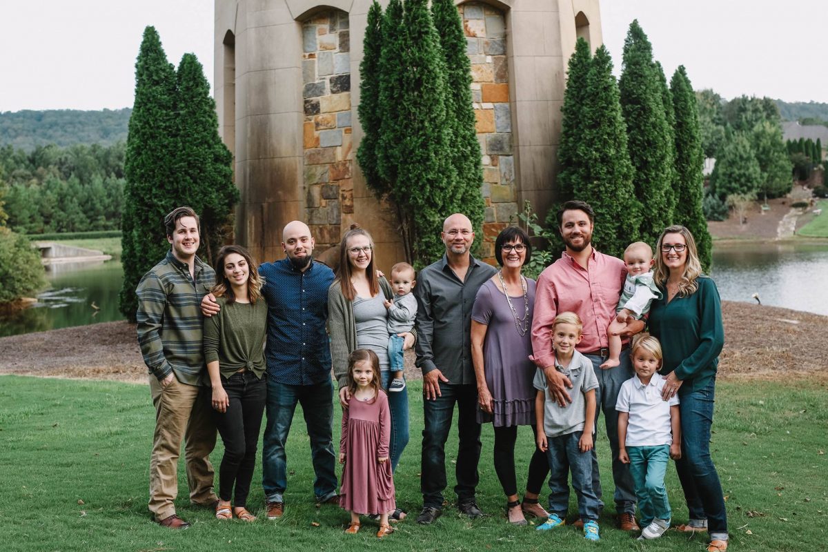 Center, Kevin Arvin and his wife, Susan stand among their children, their spouses and grandchildren during a family vacation. Arvin is a co-partner of e-footprints, a leadership coaching firm.
