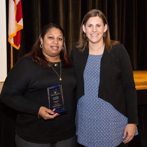 Young Alumna, Jennifer Robinson, left, stands with Faulkner’s College of Education Dean Leslie Cowell, Ph.D. after she was presented with her award in February.