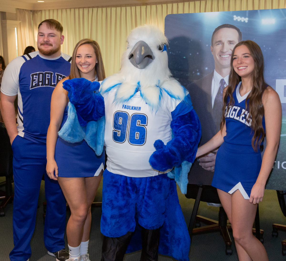 Members of the Faulkner University Cheer team pose with mascot Royal.