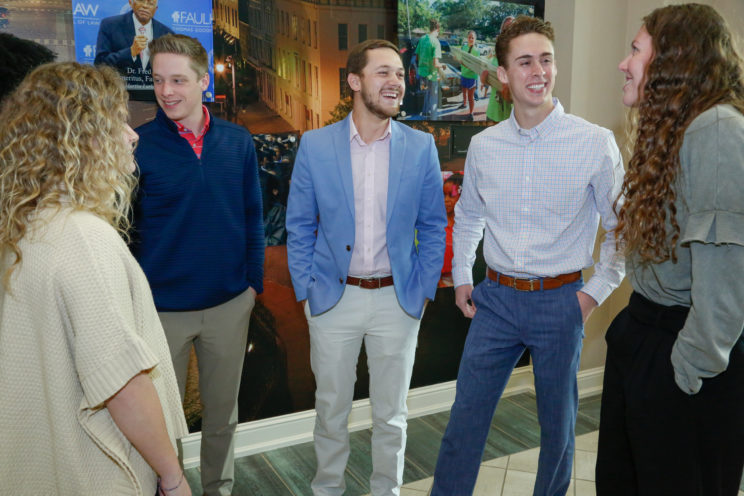 Students talking in the lobby of the business building