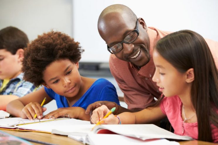 Elementary Teacher Helping Students