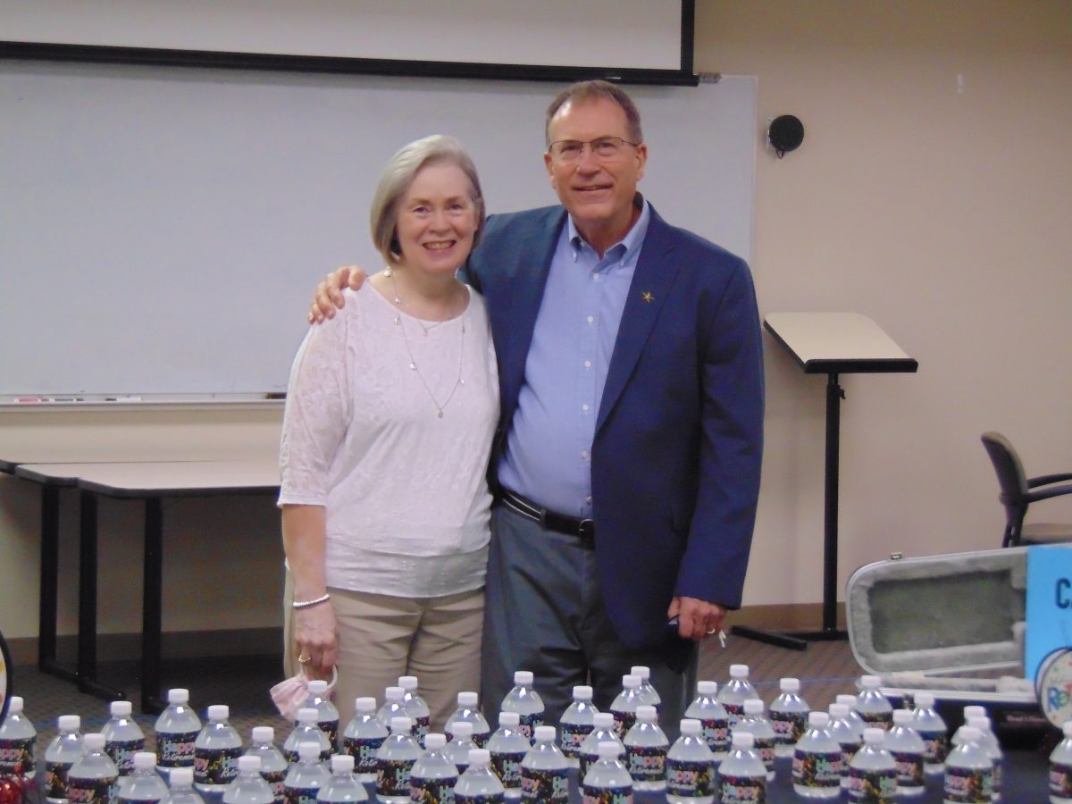 Alan Kaye stands with his wife Shirley during his retirement ceremony from the MSM program. 