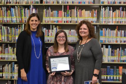 Haley Armstrong, center is honored at Marketplace Faith Friday Forums.