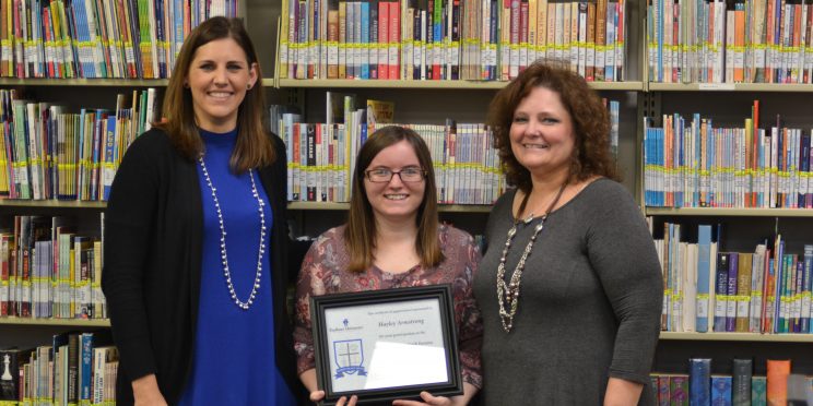 Haley Armstrong, center is honored at Marketplace Faith Friday Forums.