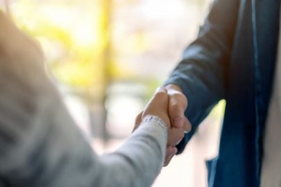 Two business executives shaking hands