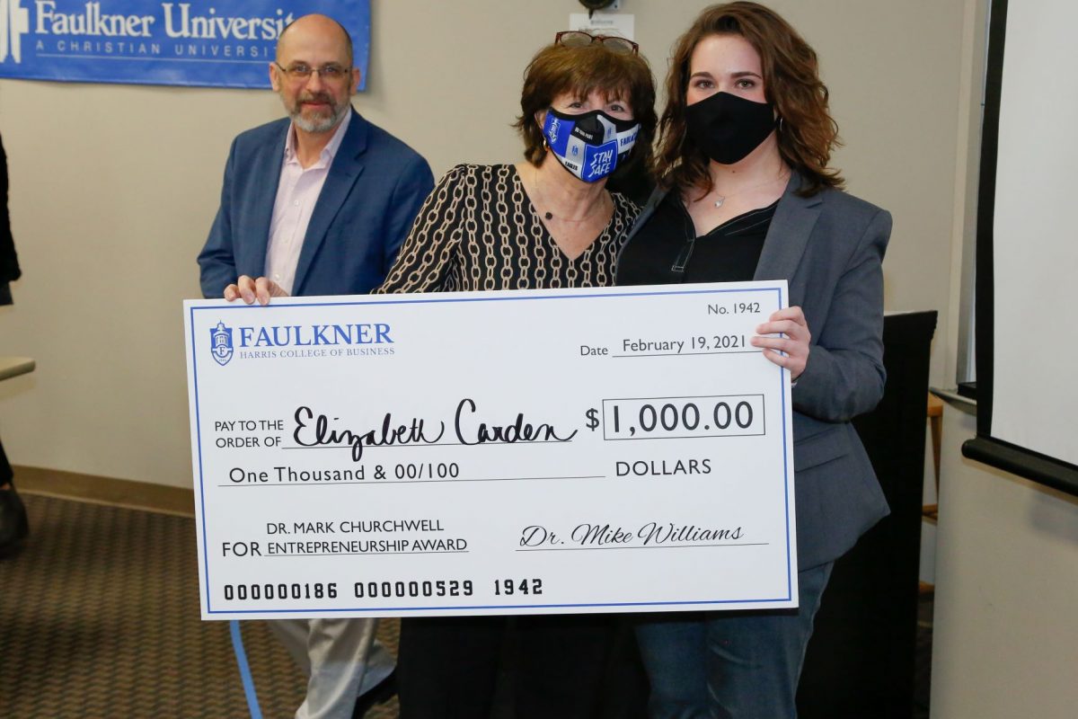 Elizabeth Carden, right, holds a check for $1,000 for the Dr. Mark Churchwell Entrepreneurship Award. Next to her are Donna Churchwell and David Gregor.