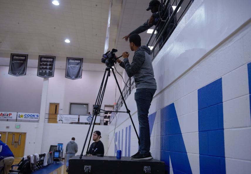Jacob Hartsfield with the Faulkner Sports Network mans the camera during this season's games while Keavonte' Lindsey assists in the balcony. 
