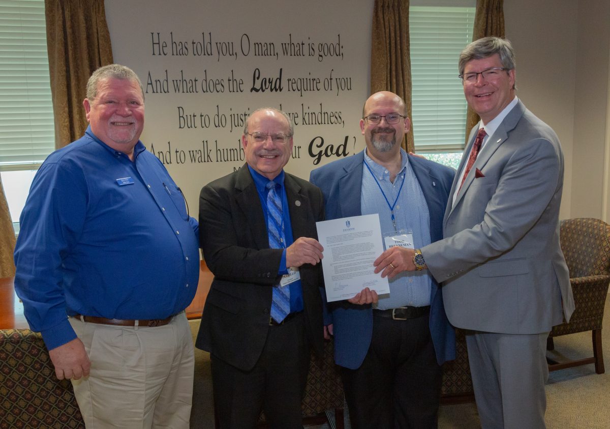 l-r Mike Horn, Denny Petrillo, Todd Brenneman, Mitch Henry sign agreement between Faulkner and Bear Valley.
