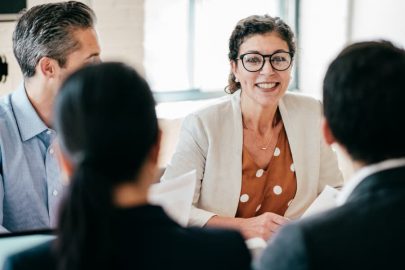 Human resources manager meets with coworkers