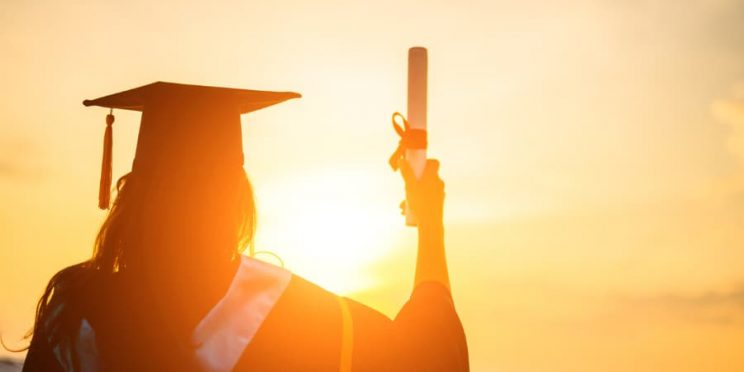 College Graduate At Sunset