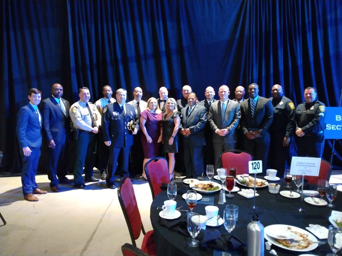 Faulkner's Graduate and Professional Enrollment team pose with several officers who came from Alaska, Massachusetts and California for the 2022 Benefit Dinner. 