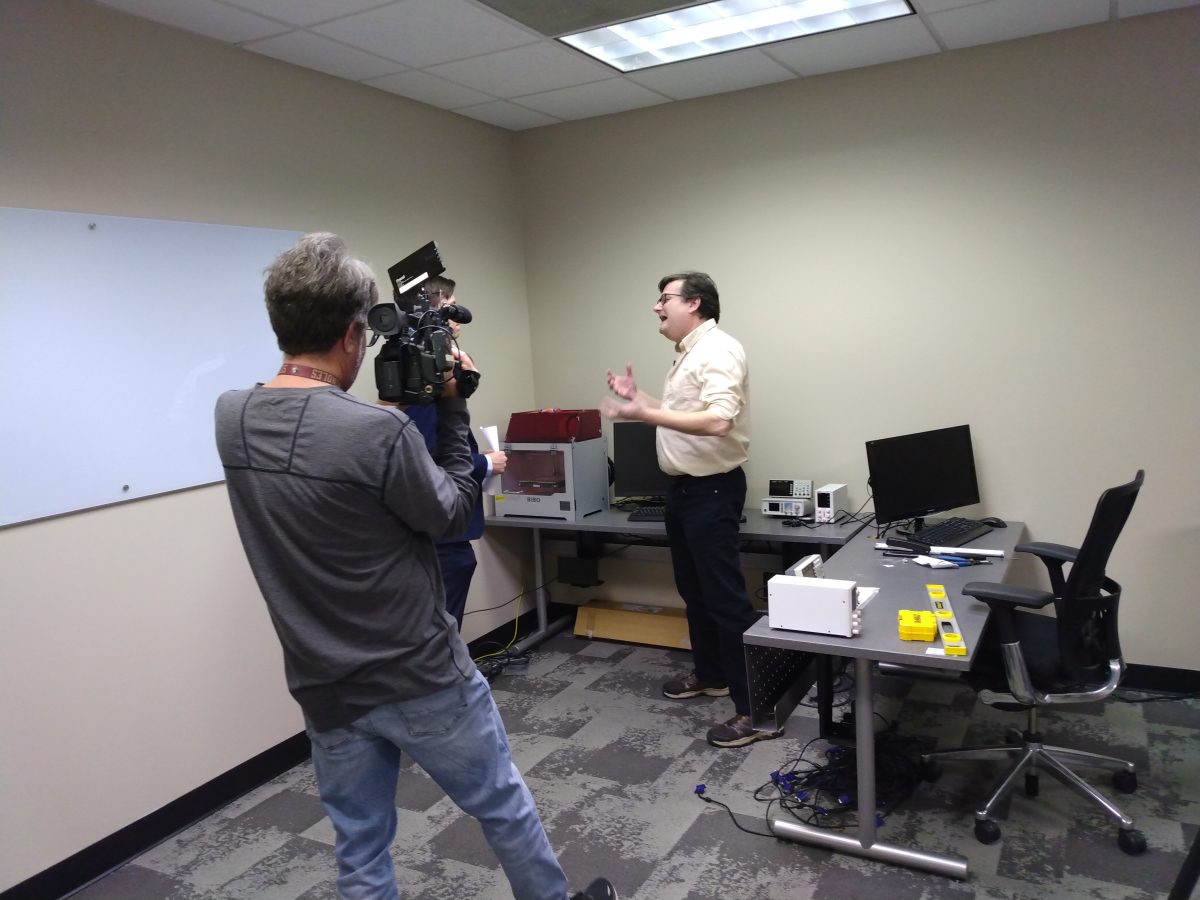 Mike Herridge, right, speaks with WSFA news crew about Faulkner's new Computer Engineering degree inside the new computer science department. 