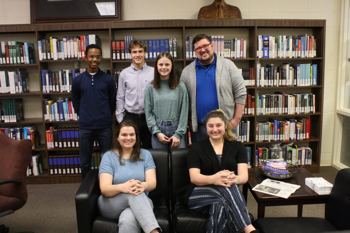 l-r Caleb Otey, Joshua Booker, Madison Allen, Peyton Jenkins. Front row l-r Jade Klose and Kayleigh Bourne. They pose for a photo inside the Gus Nichols Library.