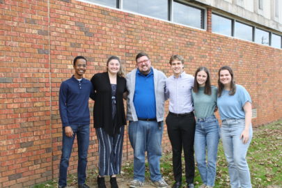 Faulkner chapter of Students for Life stand together outside the library on Faulkner's campus.