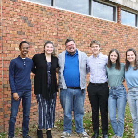 Faulkner chapter of Students for Life stand together outside the library on Faulkner's campus.