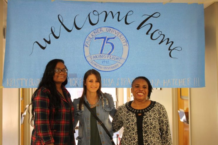 Larissa Strath, center stands with Terri Morris, left and Dr. Uduak Afangideh.