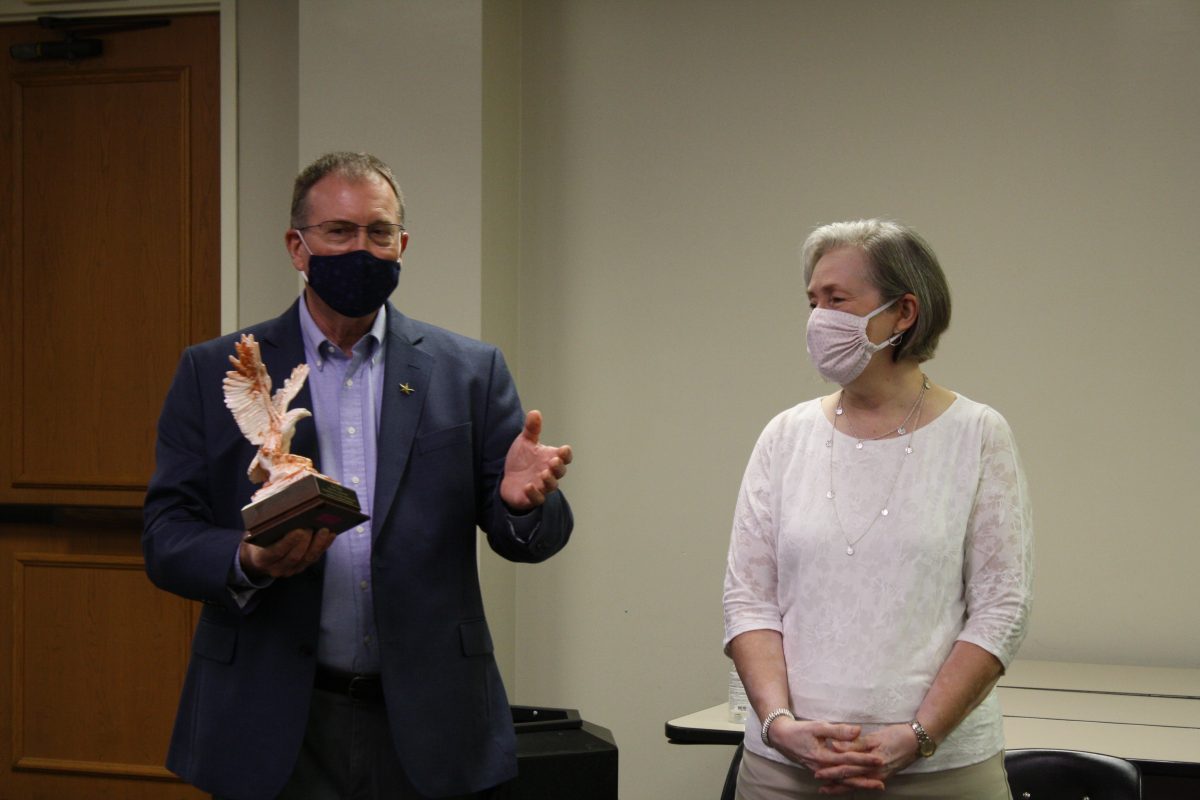 Alan Kaye stands with his wife Shirley during his retirement ceremony from the MSM program. 