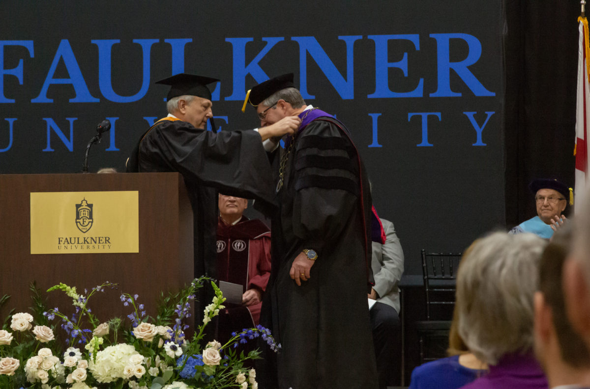 Faulkner Board of Trustees Chair Dale Kirkland, left, conducted the investiture and formally conferred the office of Faulkner’s presidency to Mitch Henry, right.