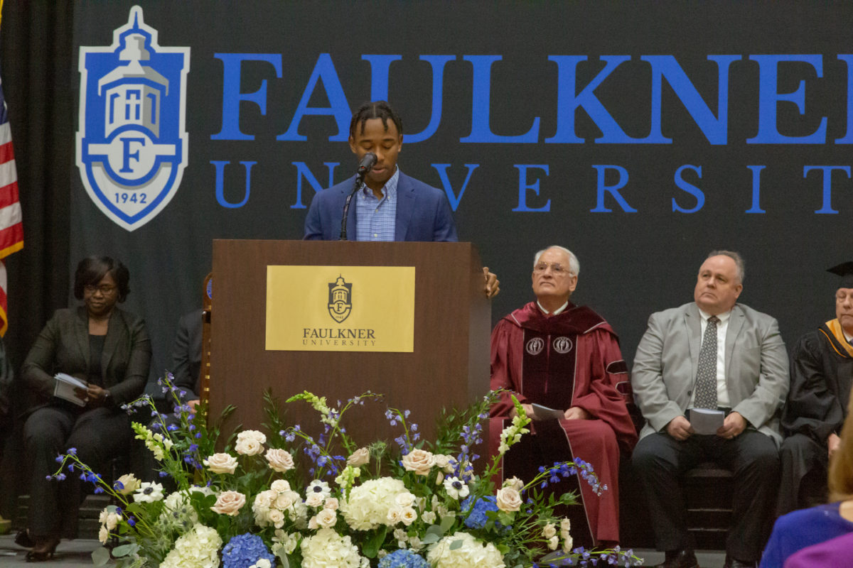 Bible major John Lay provides remarks at President Henry's inauguration.