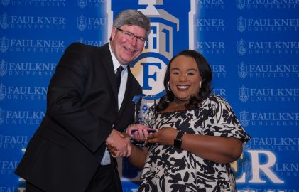 President Mitch Henry awards education alumna Indyia Rachel